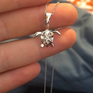 Silver Hawaiian turtle necklace with plumeria